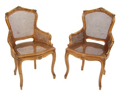 Appraisal: A pair of carved walnut fauteuil in Louis XV style