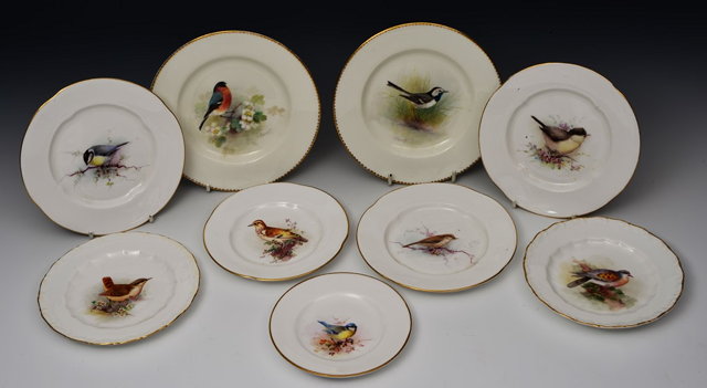 Appraisal: A COLLECTION OF NINE ROYAL WORCESTER PLATES painted with birds