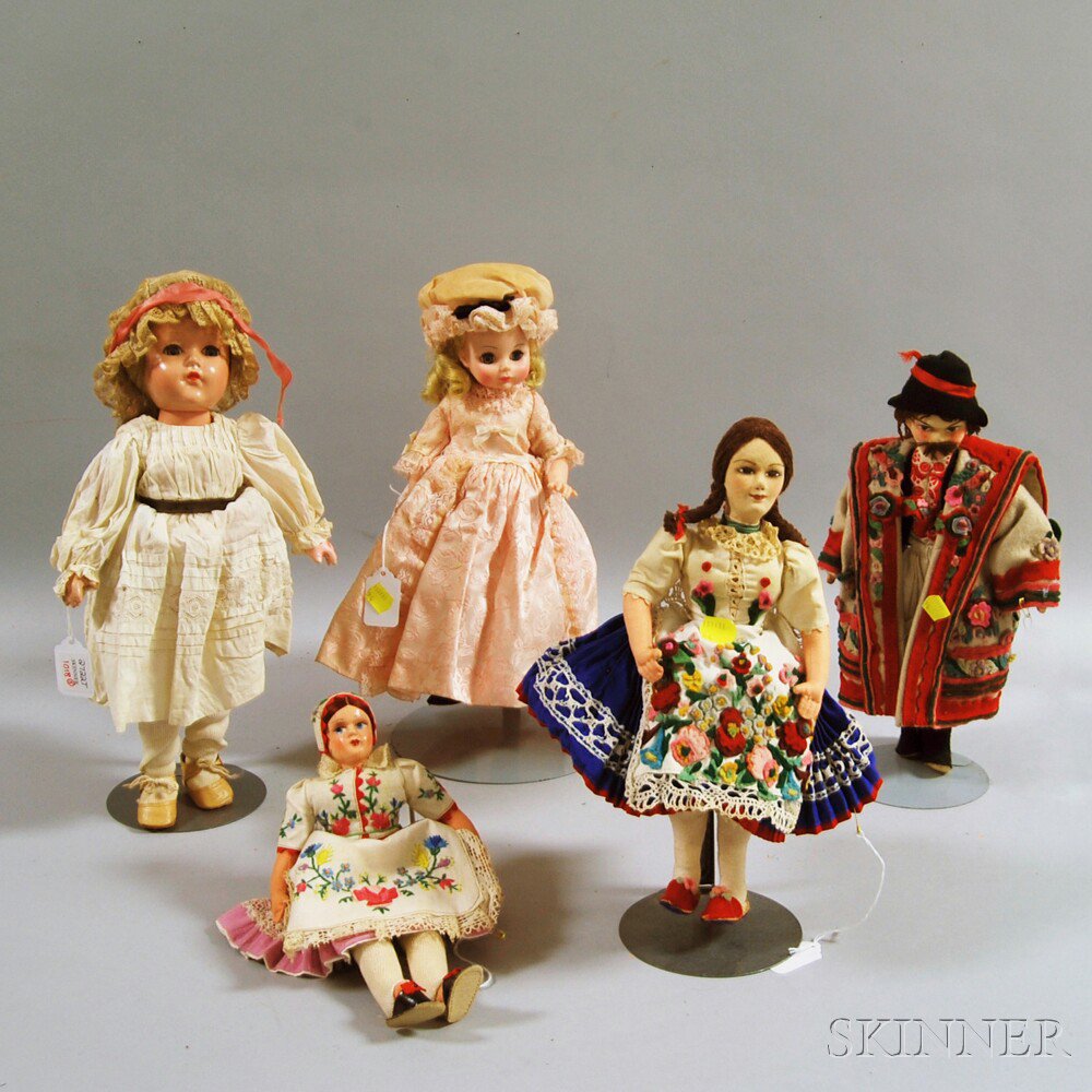 Appraisal: Five Antique Dolls a hard plastic Madame Alexander doll with