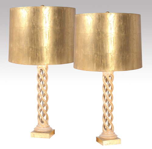 Appraisal: JAMES MONT Pair of carved wood table lamps covered in