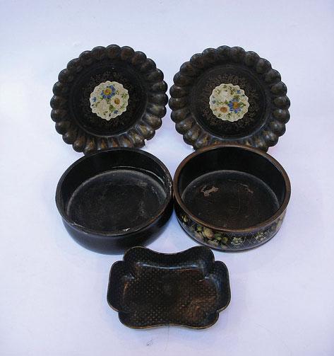 Appraisal: A PAIR OF VICTORIAN PAPIER MACHE COASTERS the centres painted