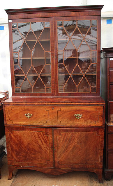 Appraisal: A SECRETAIRE BOOKCASE the glazed doors to the top enclosing