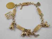 Appraisal: A yellow metal marked ct gold charm bracelet with six