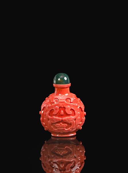 Appraisal: An orange glass bottle imitating coral Of compressed ovoid form