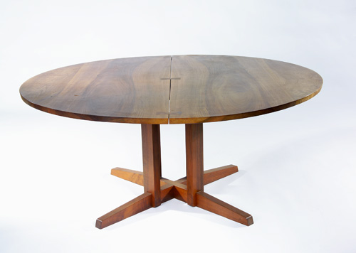 Appraisal: GEORGE NAKASHIMA Fine Cluster-Base Persian Walnut dining table with bookmatched