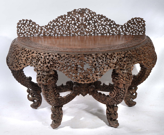 Appraisal: A BURMESE CARVED HARDWOOD LARGE SIDE TABLE of half round