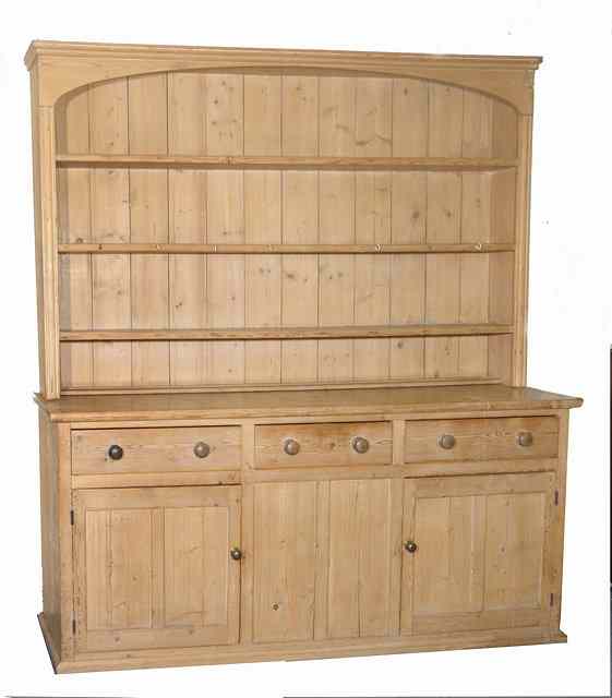 Appraisal: A LARGE VICTORIAN PINE DRESSER with three shelf plate rack