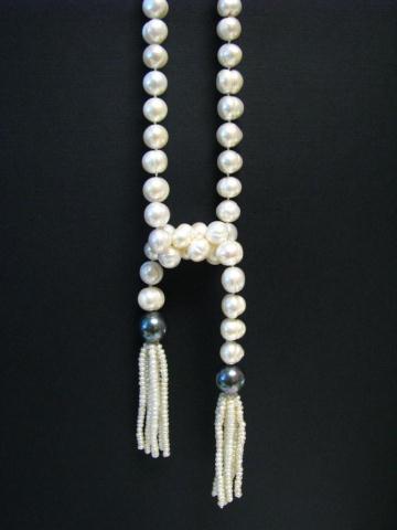 Appraisal: Strand of - mm baroque pearls '' long with fringed