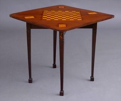 Appraisal: DUTCH MARQUETRY-INLAID FOLDING GAMES TABLE The triangular top with flower-filled