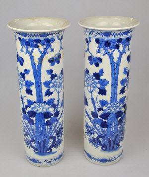 Appraisal: A pair of Chinese blue and white cylindrical vases decorated