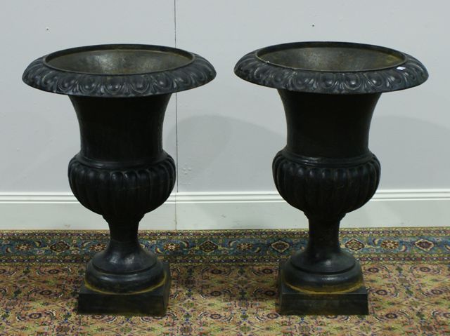 Appraisal: A pair of Swedish th century cast iron urns cm