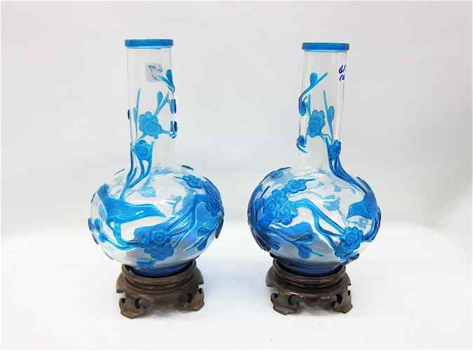 Appraisal: PAIR CHINESE CARVED PEKING GLASS VASES Blue birds and branching