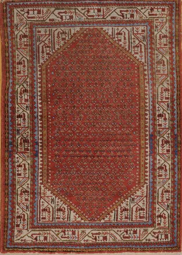 Appraisal: PERSIAN TOMATO-GROUND RUG Worked with pinecones ivory spandrels meander primary