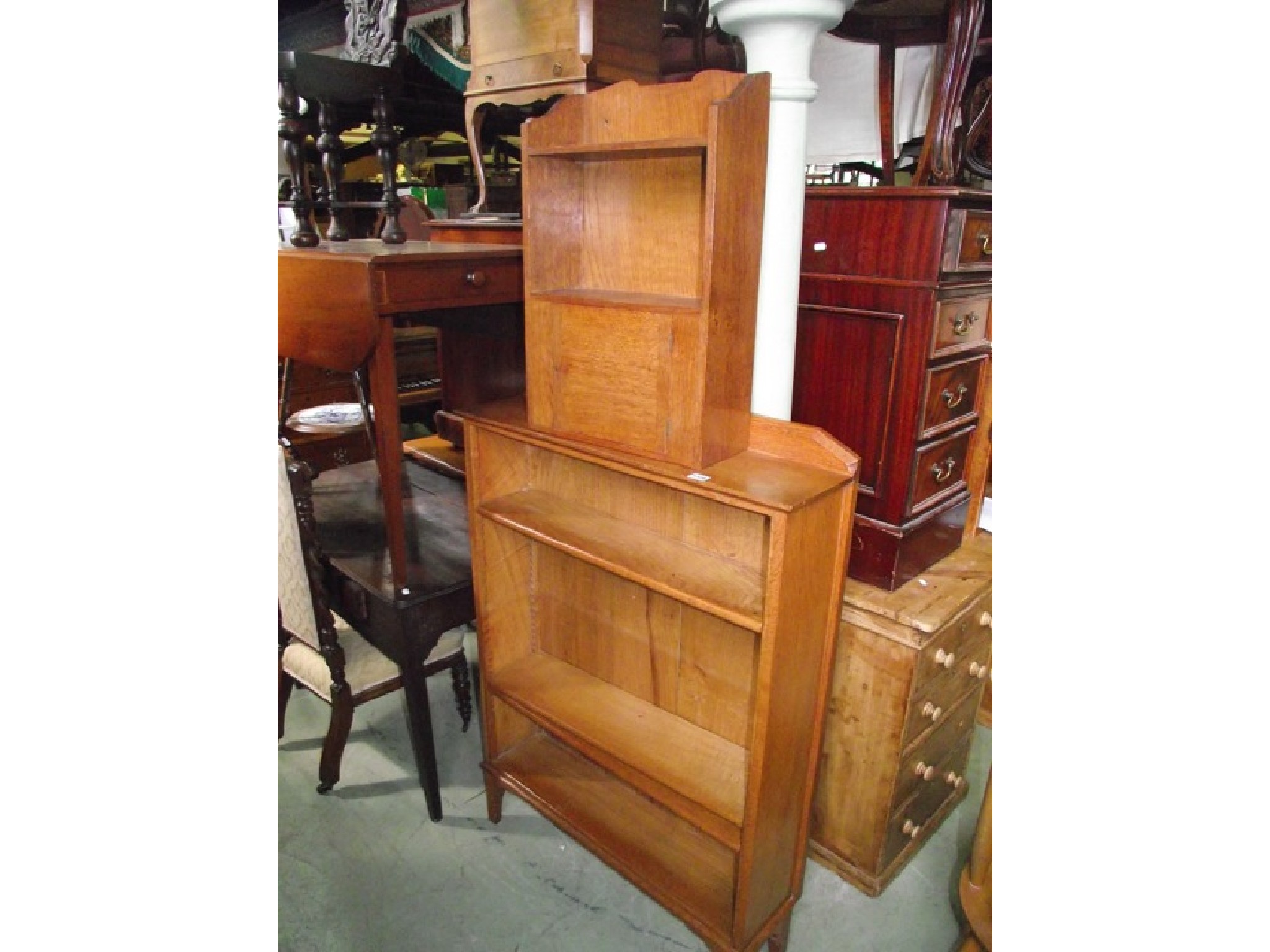 Appraisal: An arts and crafts style light oak freestanding open bookcase