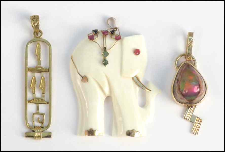 Appraisal: IVORY ELEPHANT FORM PENDANT Together with two gold pendants Condition