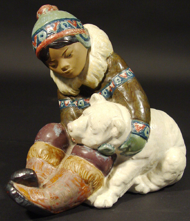 Appraisal: Lladro porcelain gris Eskimo clutching a polar bear with hand