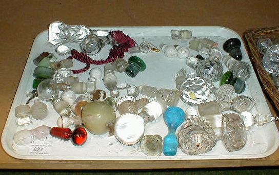 Appraisal: A quantity of glass stoppers all on shelf