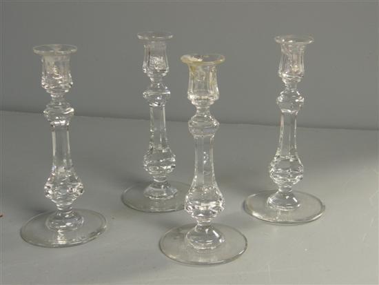 Appraisal: Set of four cut glass candlesticks of heptagonal section baluster