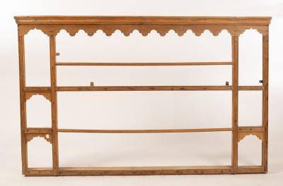 Appraisal: A pine hanging shelf with shaped apron to the cornice