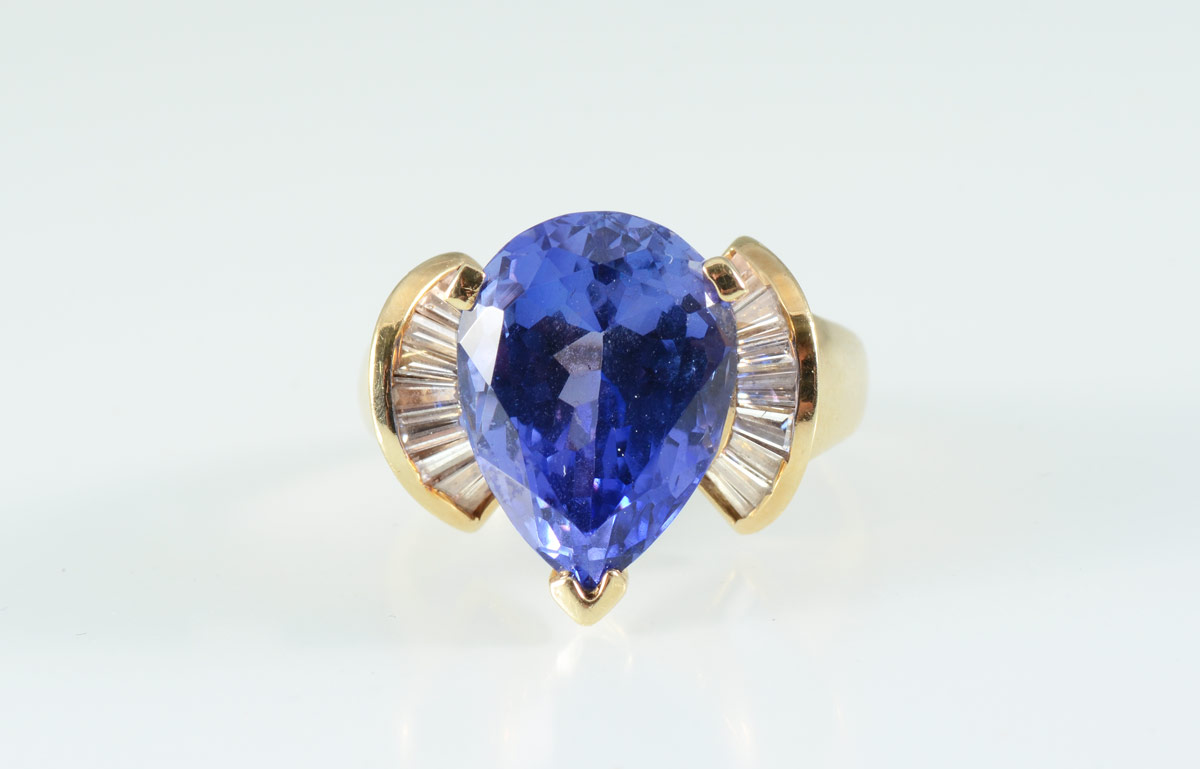 Appraisal: CT PEAR SHAPED TANZANITE RING WITH DIAMONDS K yellow gold