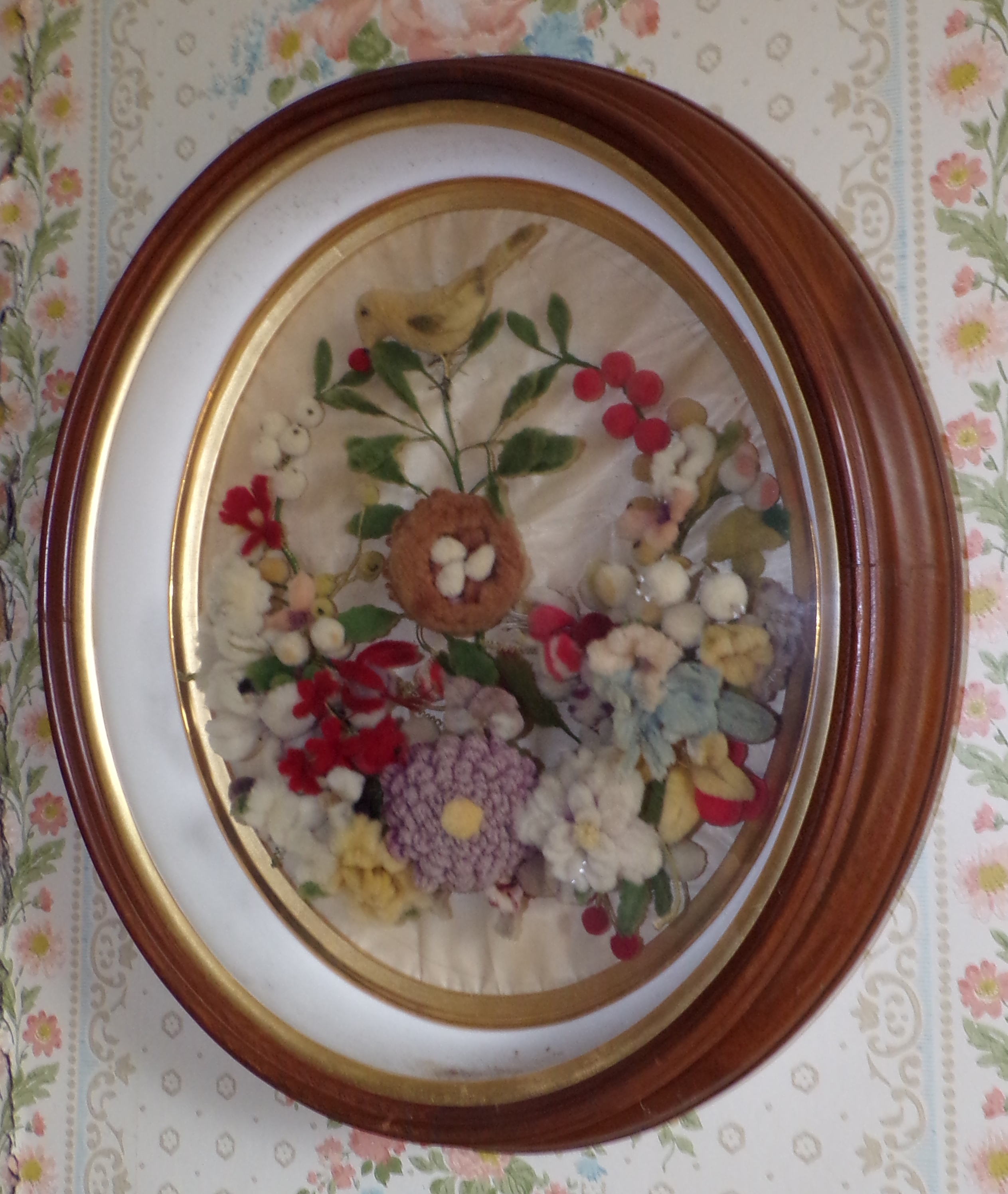 Appraisal: Needlepoint textile wreath of flowers in shadow box frame x