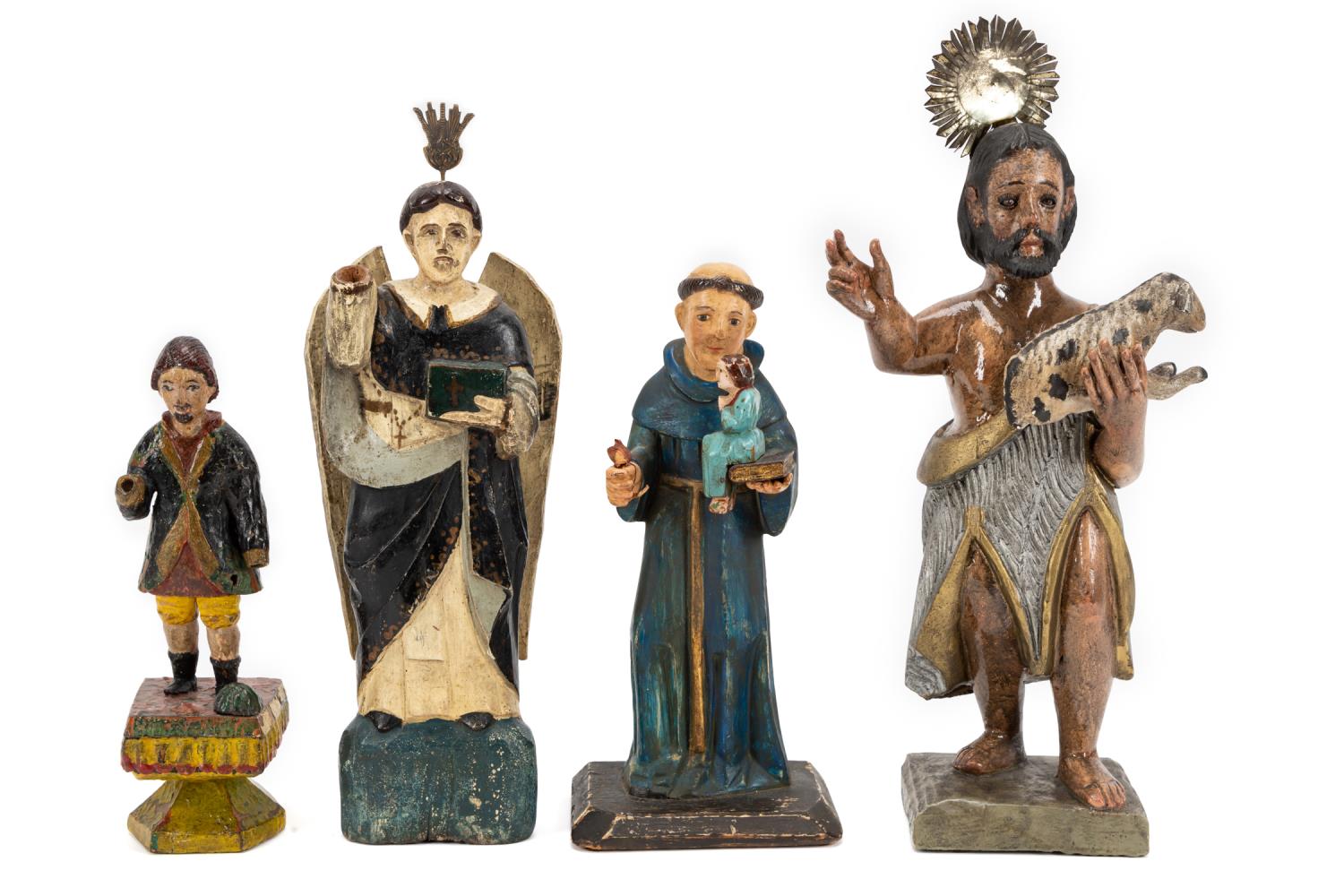 Appraisal: FOUR SPANISH COLONIAL STYLE CARVED SANTOS FIGURES Four carved wooden