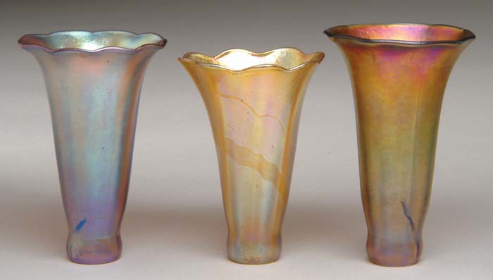 Appraisal: TIFFANY STUDIOS LILY SHADES Three gold Favrile lily shades are