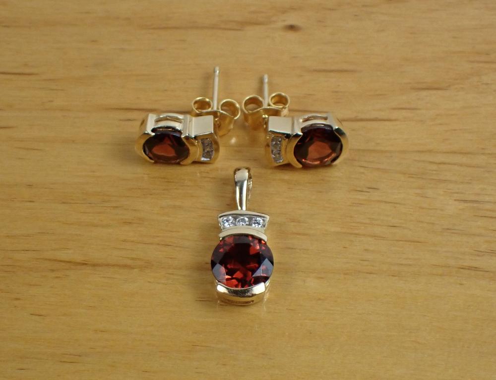 Appraisal: ALMANDINE GARNET AND DIAMOND PENDANT AND EAR STUD SET including