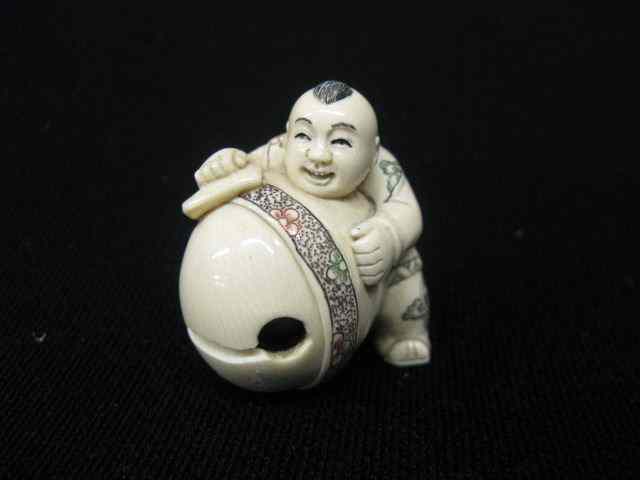 Appraisal: Carved Ivory Netsuke of Man with Giant Bell fancy polychrome