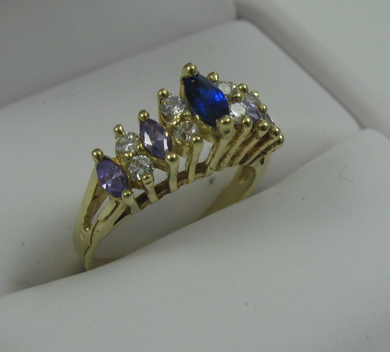 Appraisal: SAPPHIRE AND FOURTEEN KARAT GOLD RING centering a marquise-cut blue