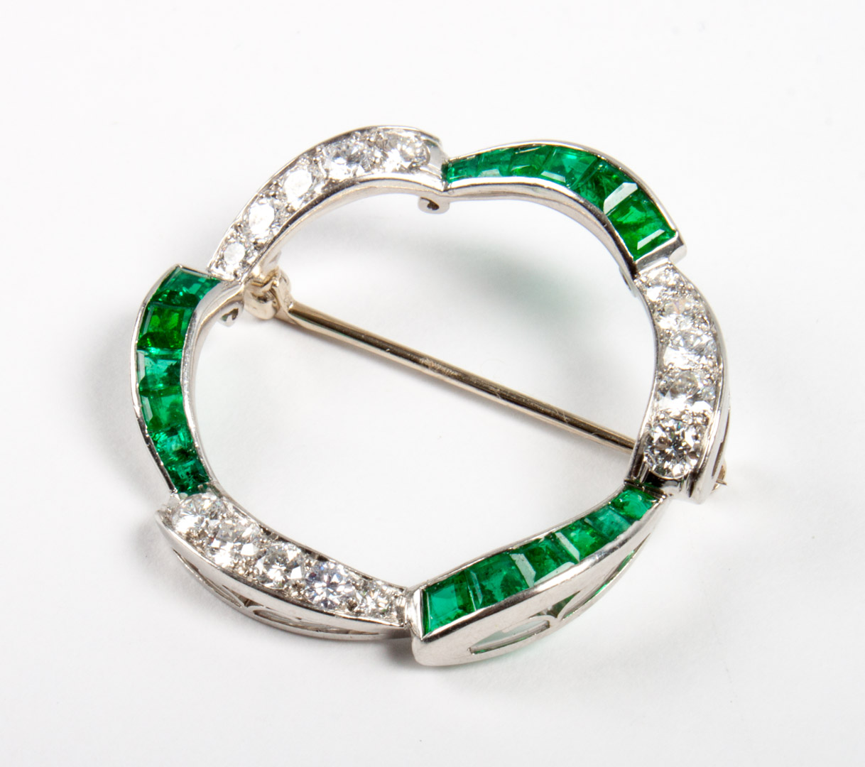 Appraisal: Platinum gold diamond emerald brooch modeled as a ring with