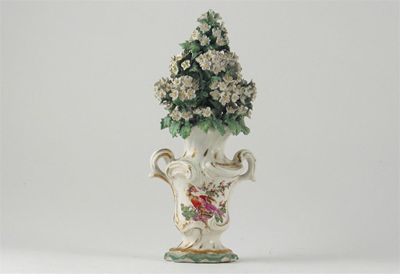 Appraisal: A Derby rococo moulded flower vase each side painted with