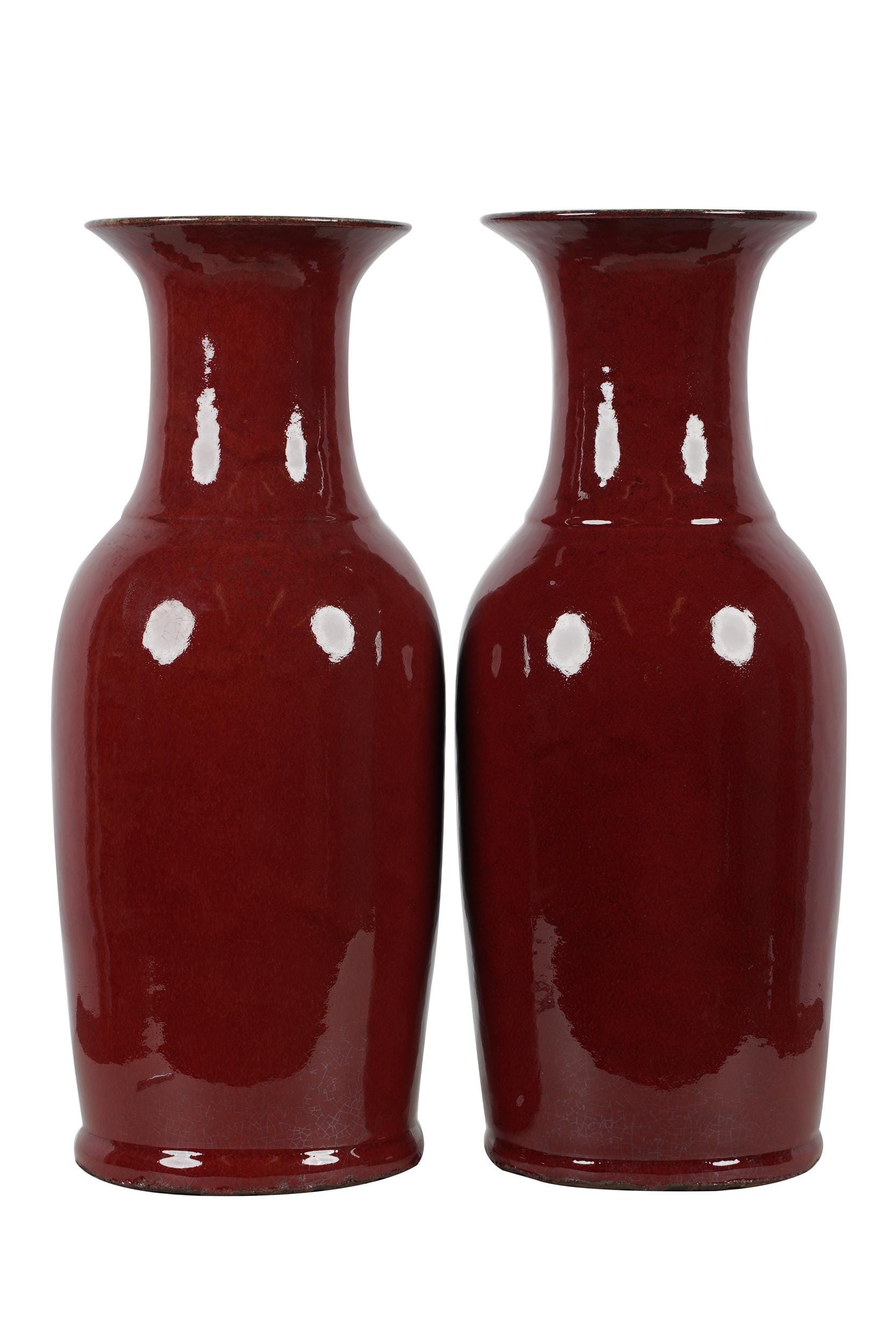 Appraisal: PAIR OF PORCELAIN BALUSTER VASES unmarked with oxblood-style glaze inches