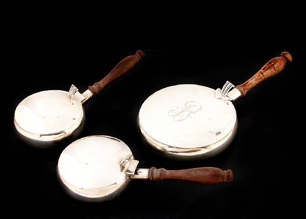 Appraisal: A group of three Mexican sterling silent butlers with wooden