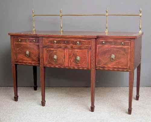 Appraisal: A George III mahogany break-front sideboard inlaid with satinwood bandings