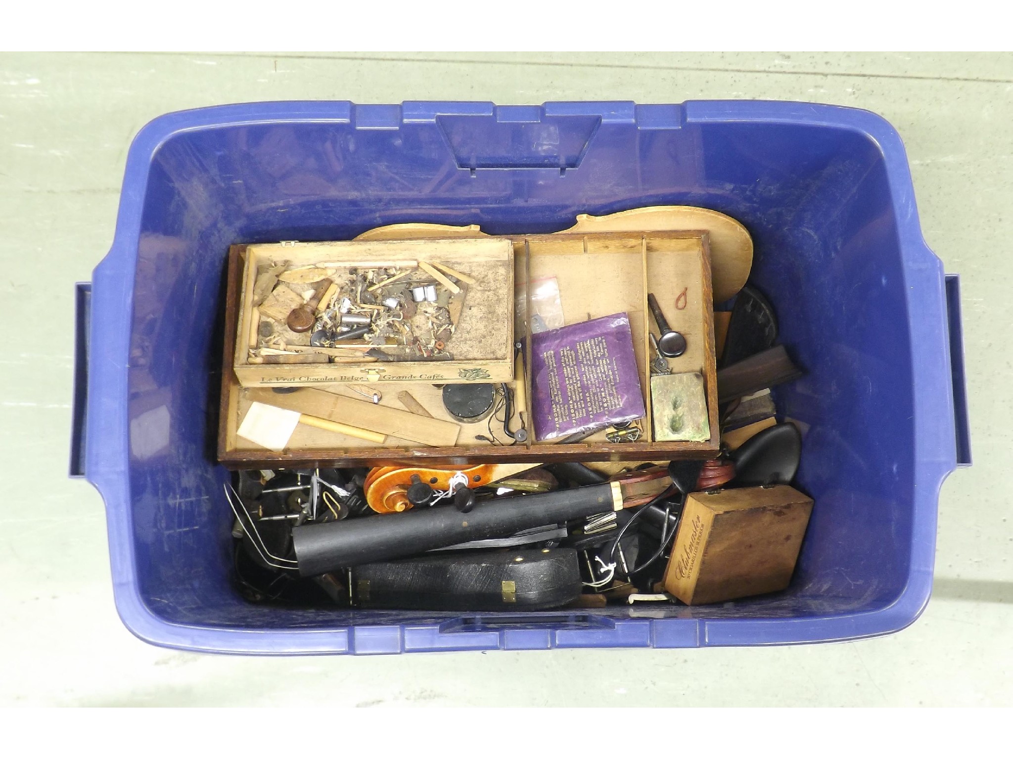 Appraisal: Box of various stringed instrument fittings and parts including tailpieces