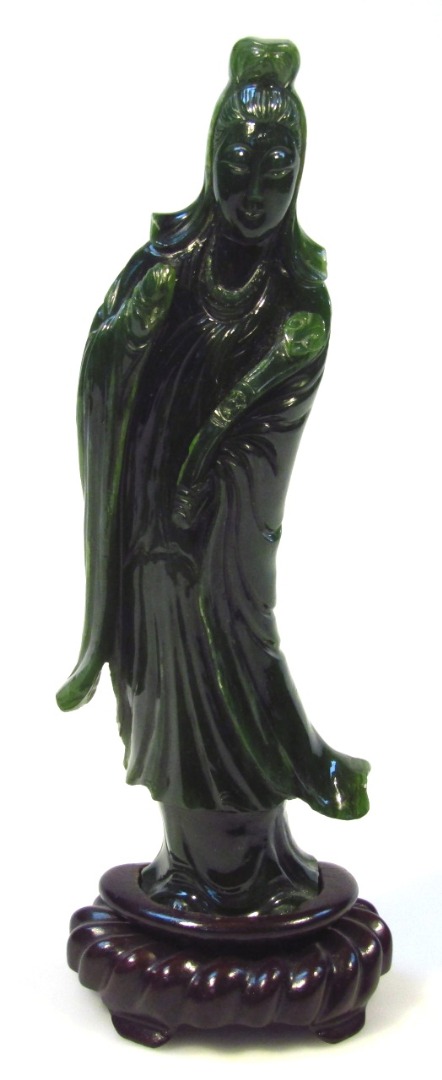 Appraisal: An early thC jadeite figure of a standing geisha in