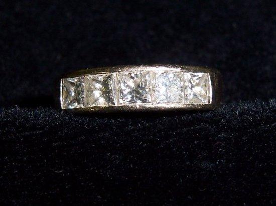 Appraisal: A five stone diamond half eternity ring in a contemporary