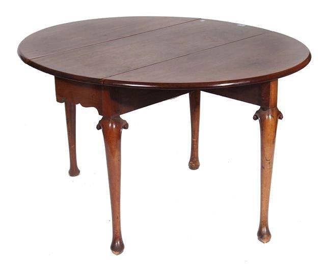 Appraisal: AN TH CENTURY MAHOGANY OVAL DINING TABLE with drop leaves