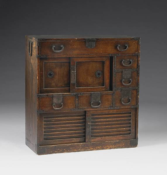 Appraisal: A stained kiri-wood single section tansu Meiji Taisho Period Composed