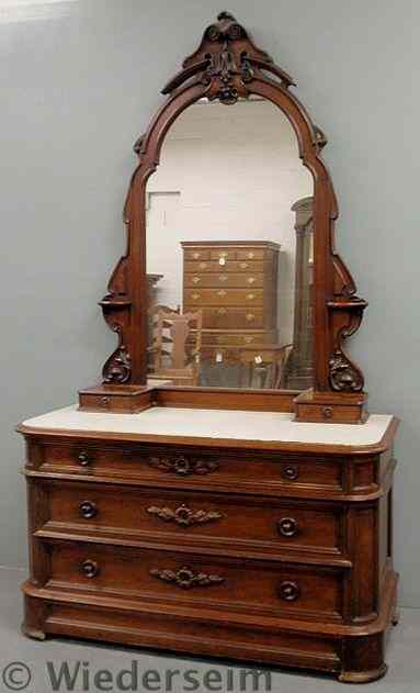 Appraisal: Large Victorian carved walnut dresser with a framed mirror and