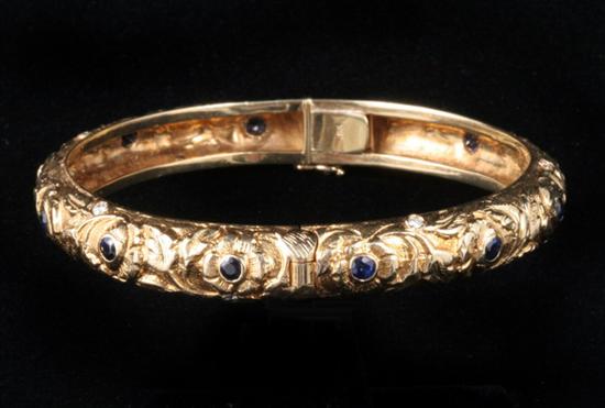 Appraisal: K YELLOW GOLD DIAMOND AND SAPPHIRE HINGED ROUND BANGLE BRACELET