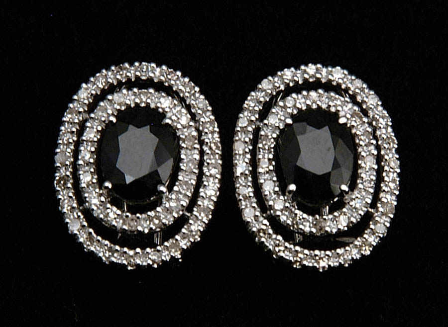 Appraisal: SAPPHIRE AND DIAMOND EARRINGS kt white gold earrings have center