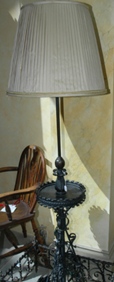 Appraisal: A TH CENTURY FRENCH WROUGHT IRON STANDARD LAMP The tubular