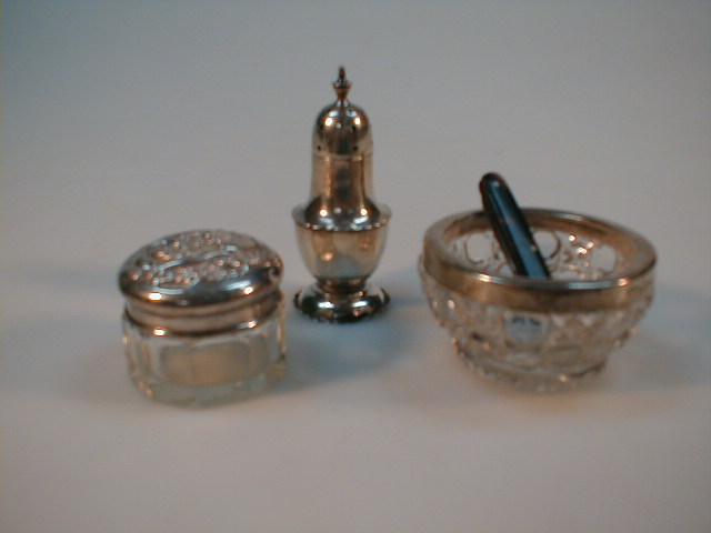 Appraisal: A silver pepper pot silver top rouge pot glass salt