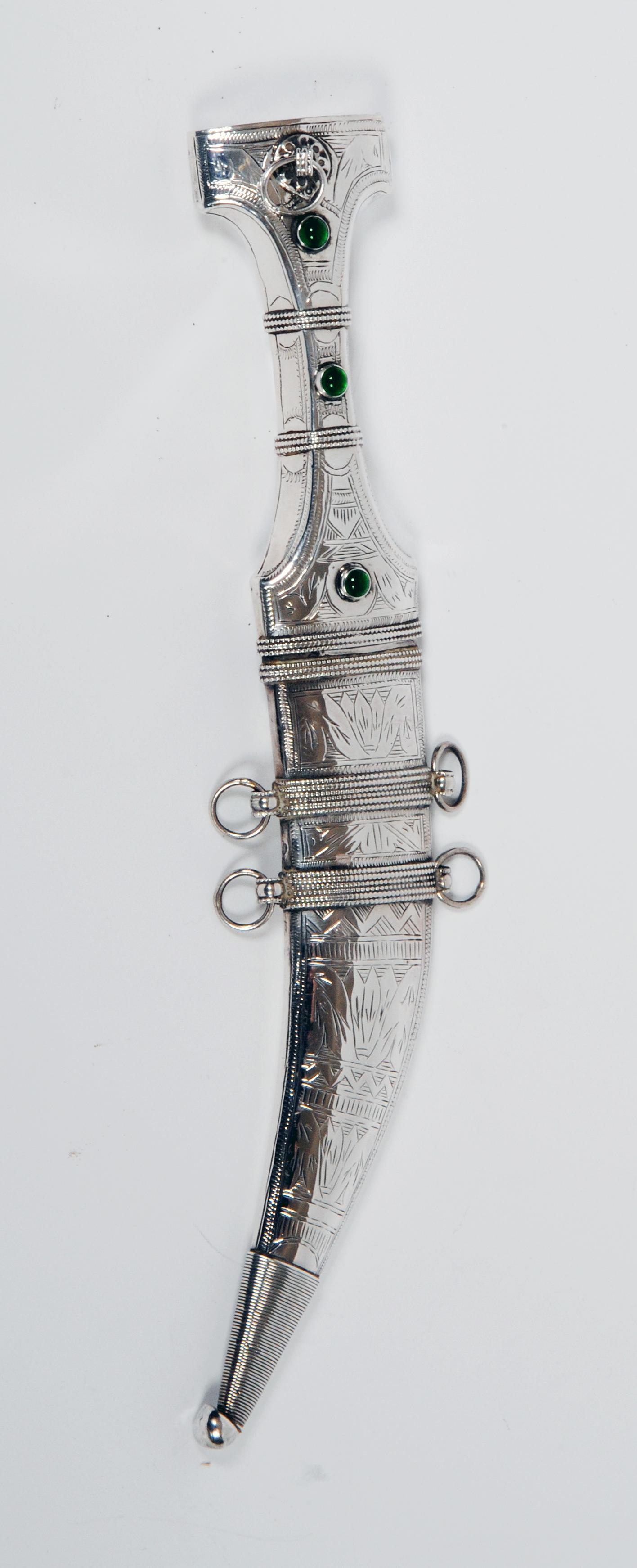 Appraisal: AN ARAB SILVER MOUNTED JAMBIYA mid th century the hilt