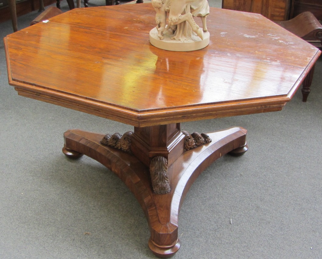 Appraisal: A Regency rosewood octagonal snap top centre table on canted