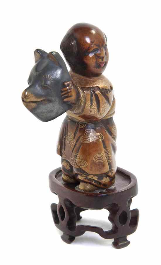 Appraisal: A Lacquered Wood Netsuke of a Man depicting a man