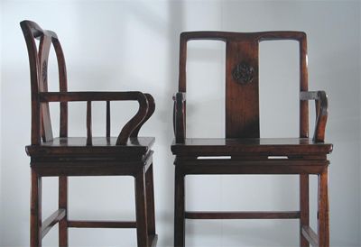 Appraisal: A pair of Chinese hardwood armchairs each carved on the