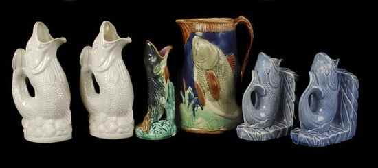 Appraisal: A Continental majolica jug moulded in relief with fish cm